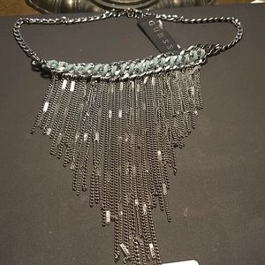 Brand new silver tone fun necklace! New w tags.  Brand. Guess